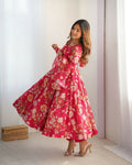 A vibrant pink organza kurta set with intricate sequin embroidery and matching cotton trousers.