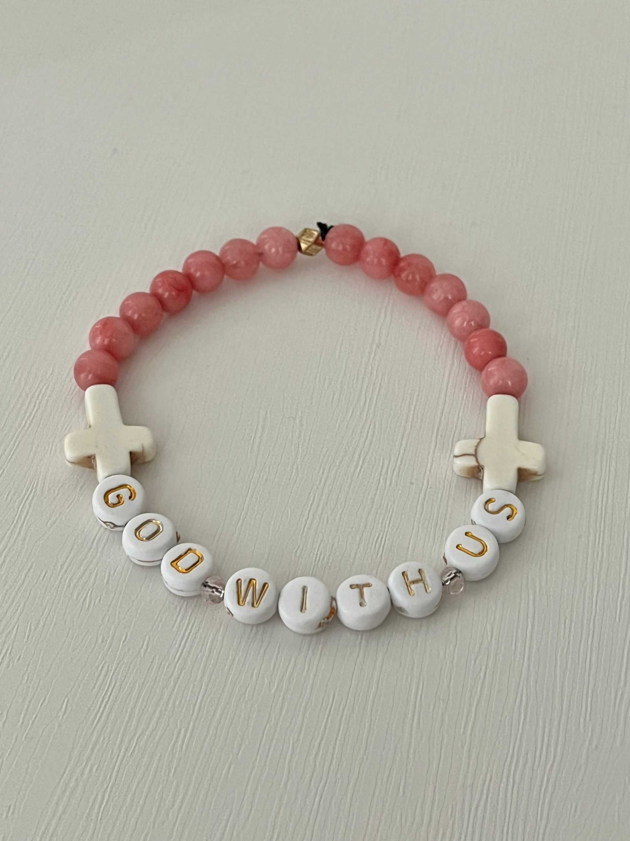 Pink Marble God With Us Bracelet featuring marbled beads and a symbolic charm.