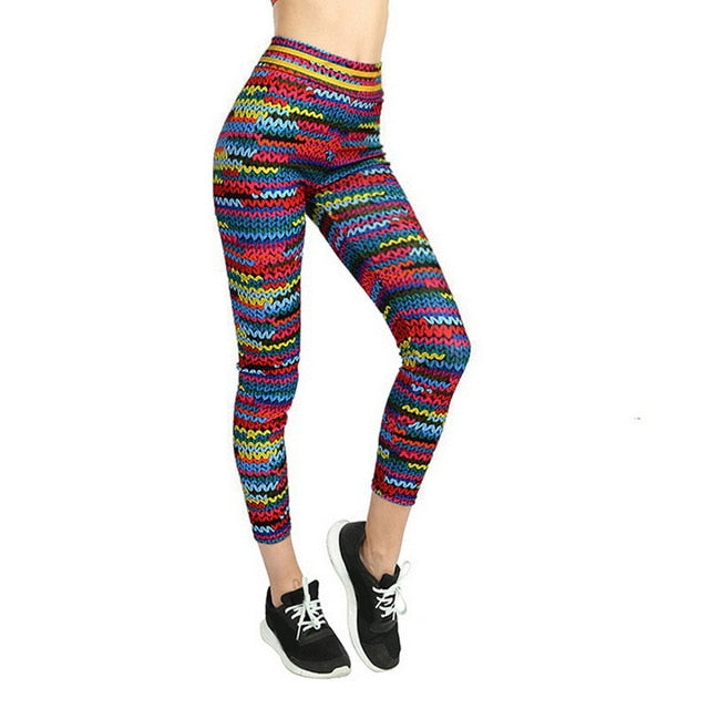 Multicolor knit print high-waist women's athletic leggings featuring a vibrant zigzag pattern, worn by a model against a white background.