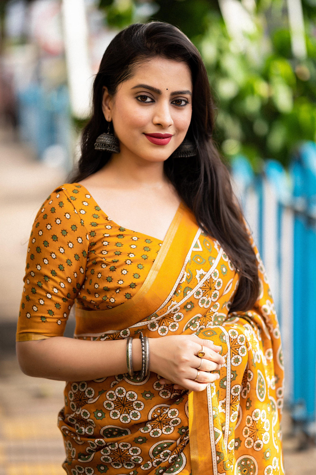 Mustard Cotton Blend Ajrak Saree with Zari Border and Blouse Piece