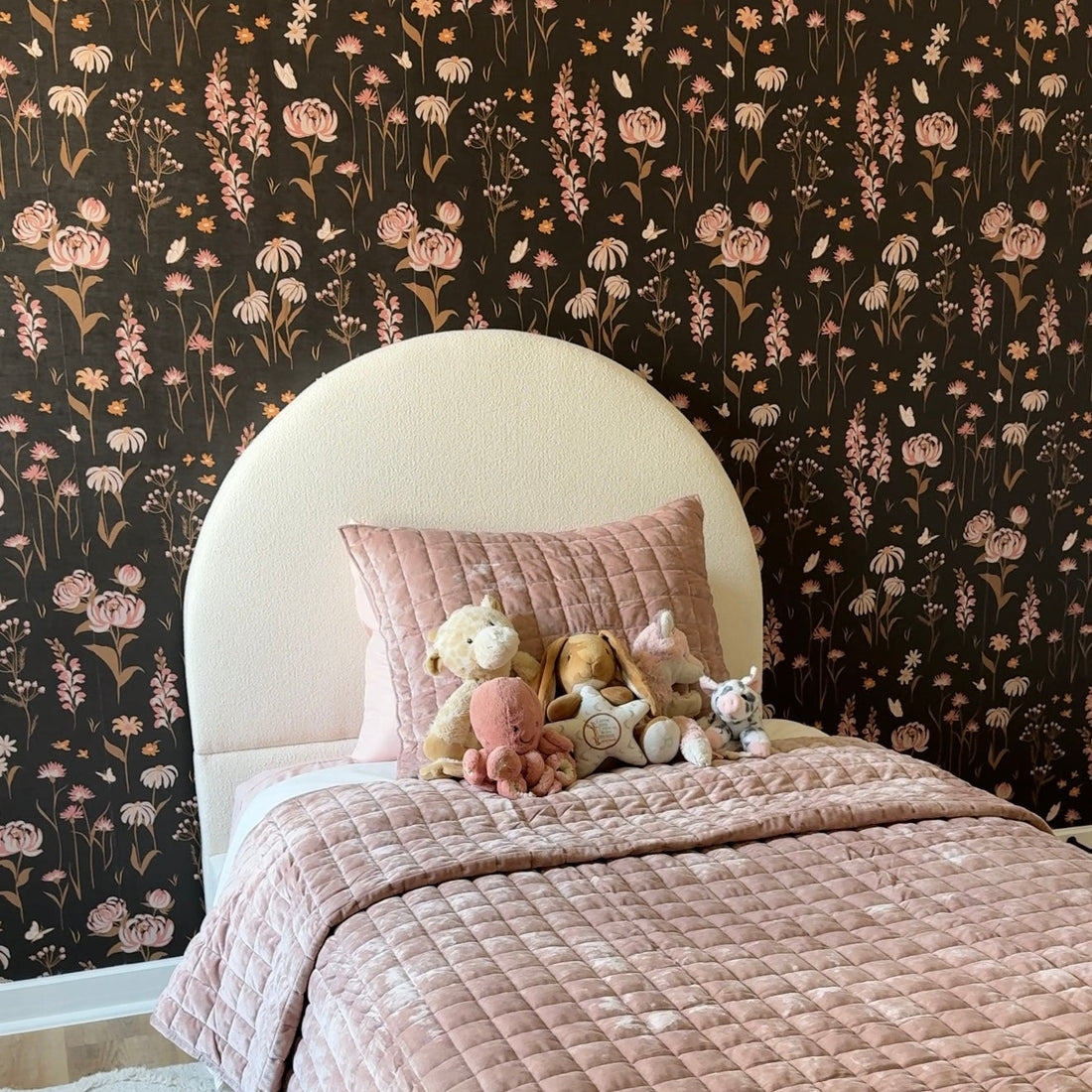 Audrey floral wallpaper featuring blush-pink, dusty-rose, and black petals in a romantic bohemian style.