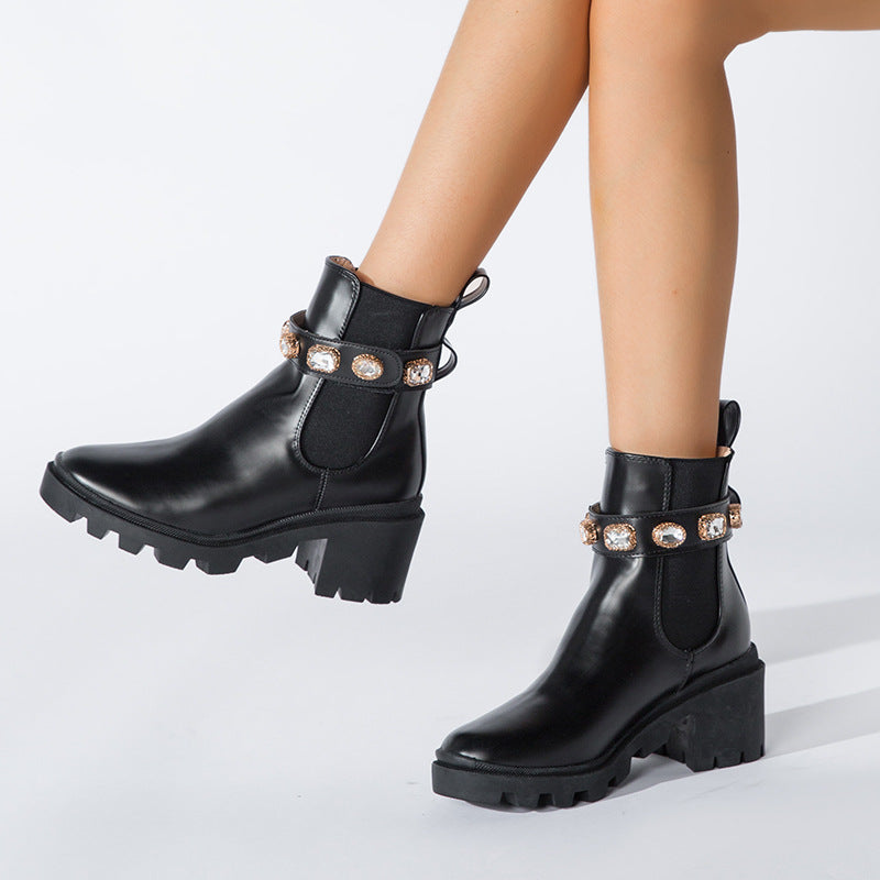 Women's black and white rhinestone embellished Chelsea ankle boots with chunky lug sole, featuring elastic side panels.