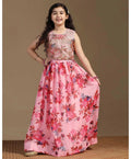 A vibrant peach girls lehenga choli made of tabby silk fabric