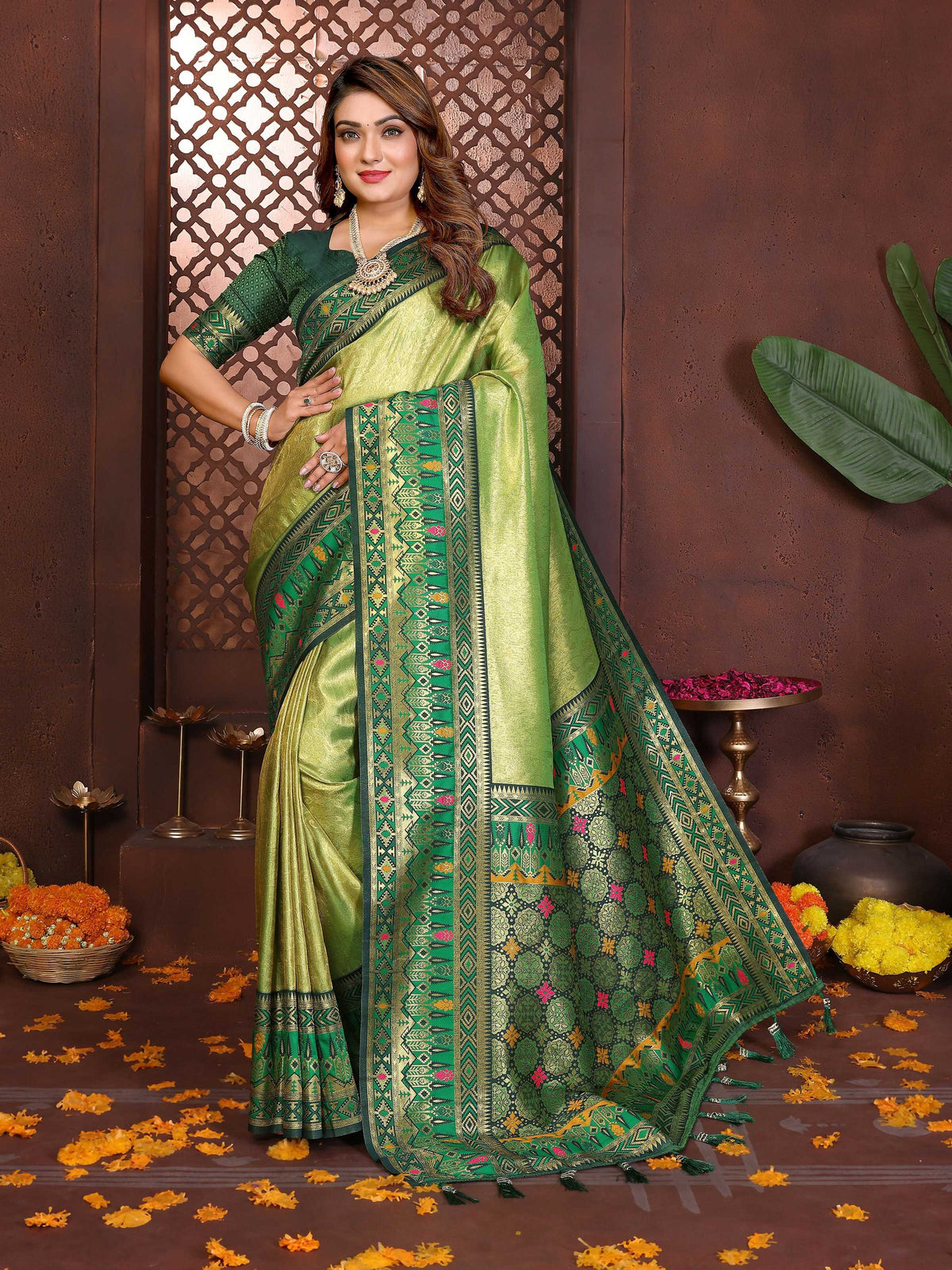 Aastha Fashion Pista Tissue Silk Weaving Saree with intricate woven patterns and matching green blouse
