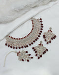 Elegant maroon stone work necklace set with matching earrings and maang tikka for ethnic wear