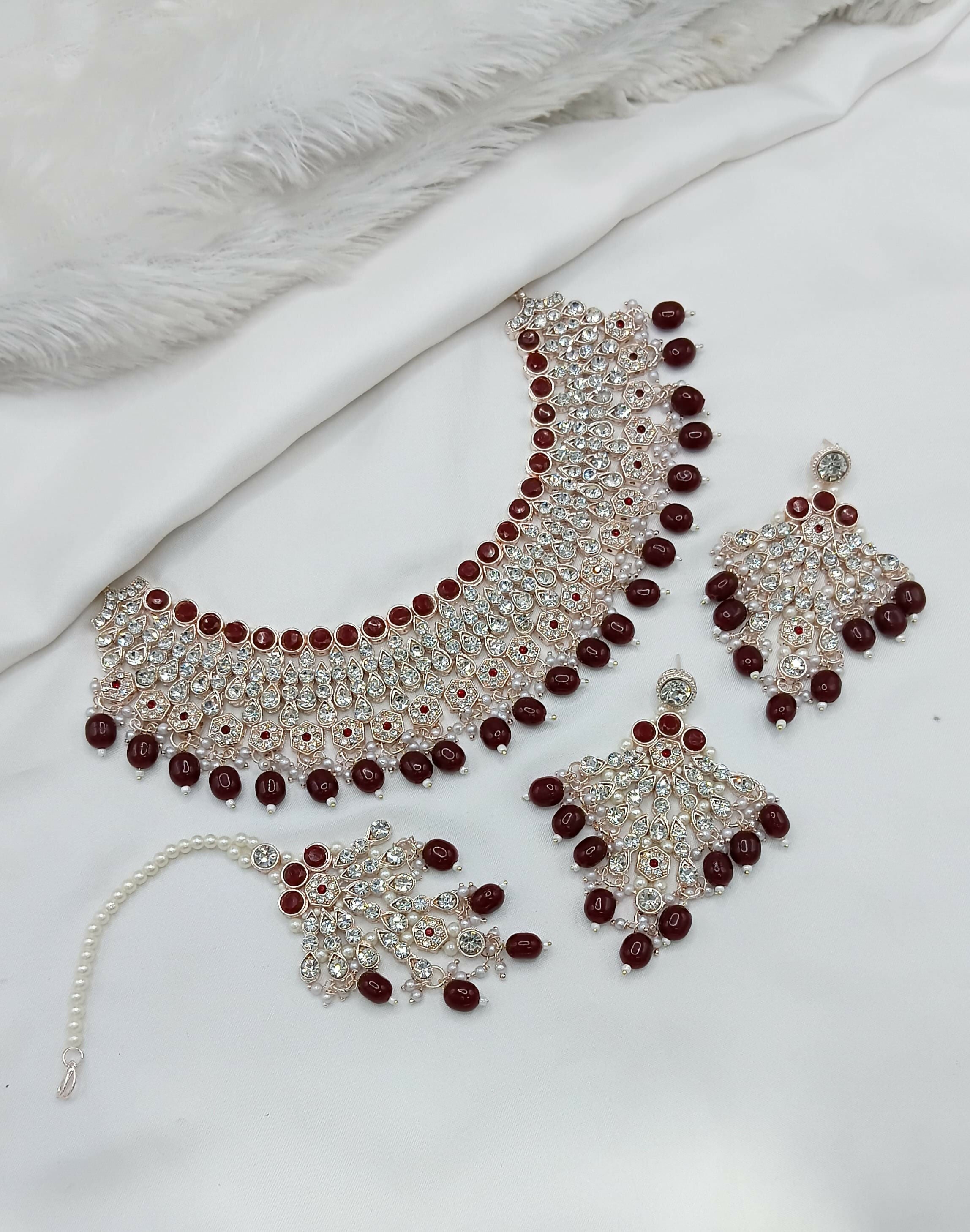 Elegant maroon stone work necklace set with matching earrings and maang tikka for ethnic wear