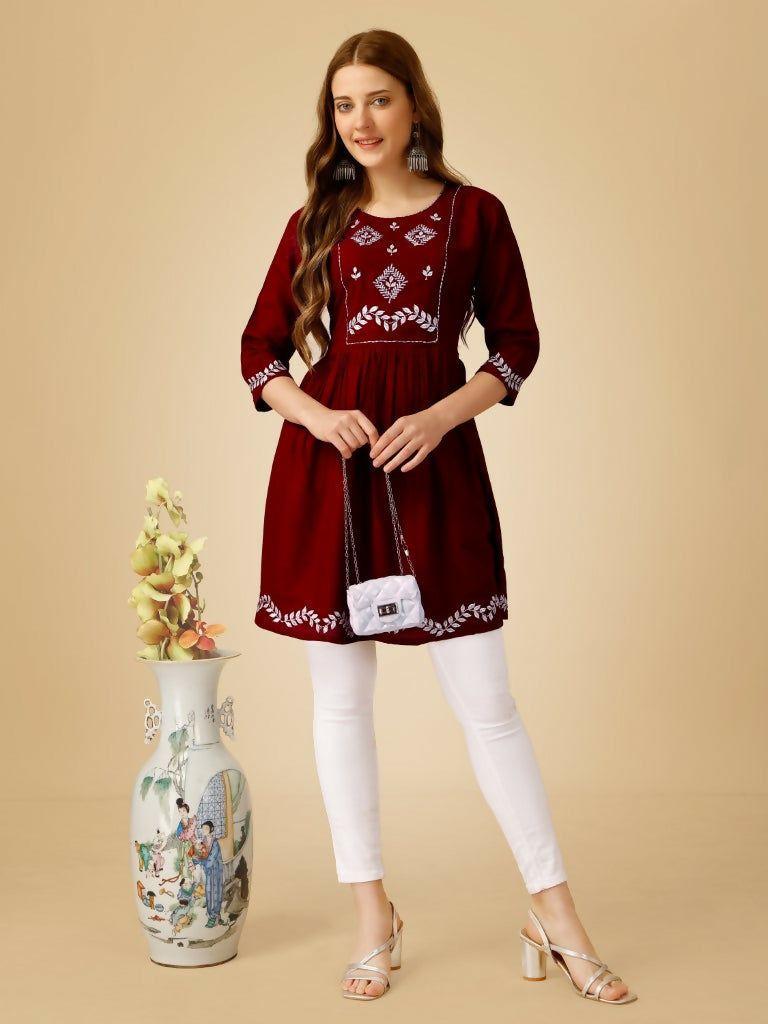 Maroon casual top featuring intricate embroidery and sequence work in viscose rayon
