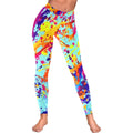 A model wearing Harajuku style women's low rise leggings with a vibrant, colorful paint splatter print in blue, yellow, orange, pink, and purple, shown from the front and side.