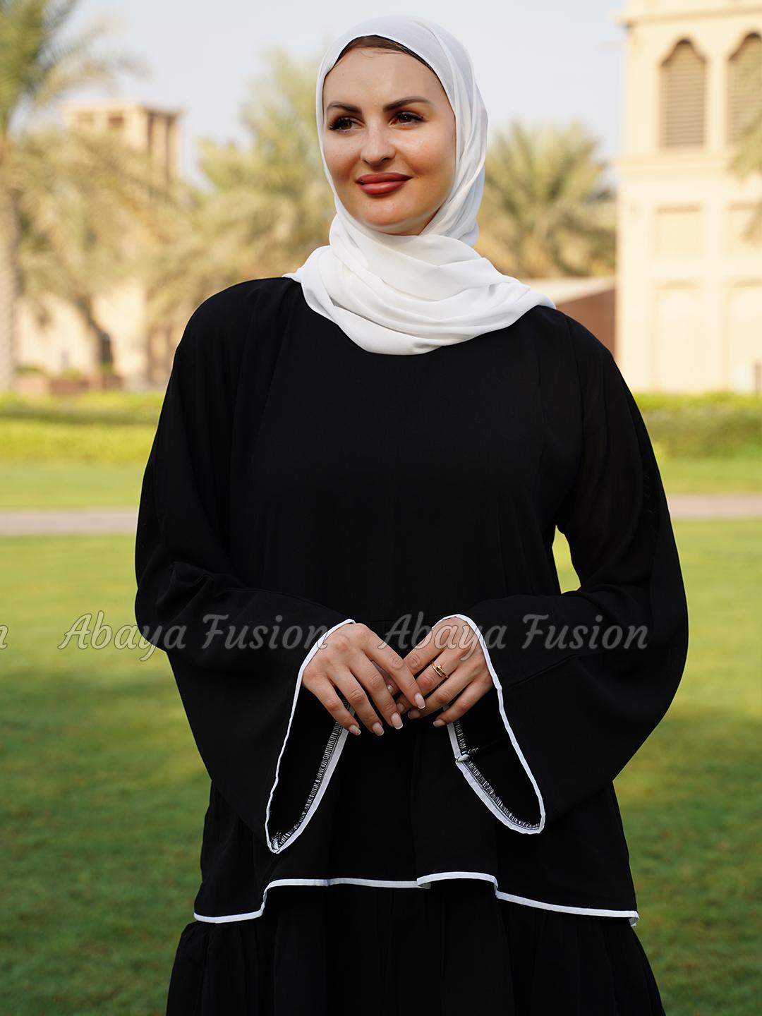 Abaya black with frill work in white Piping