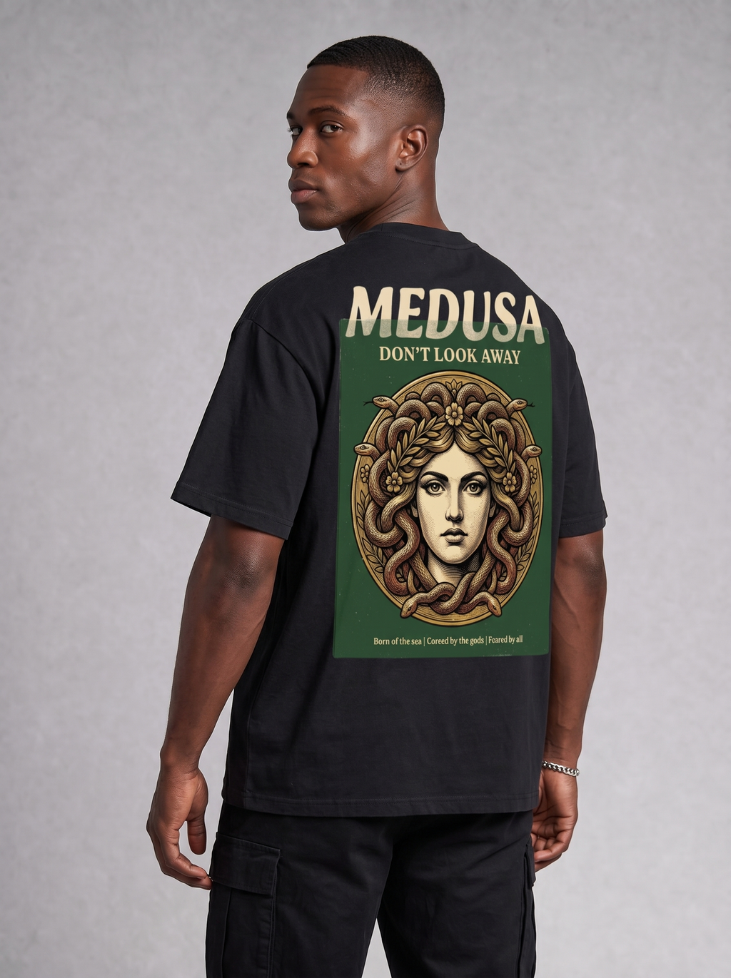 Forest green oversized graphic t-shirt with Medusa medallion print