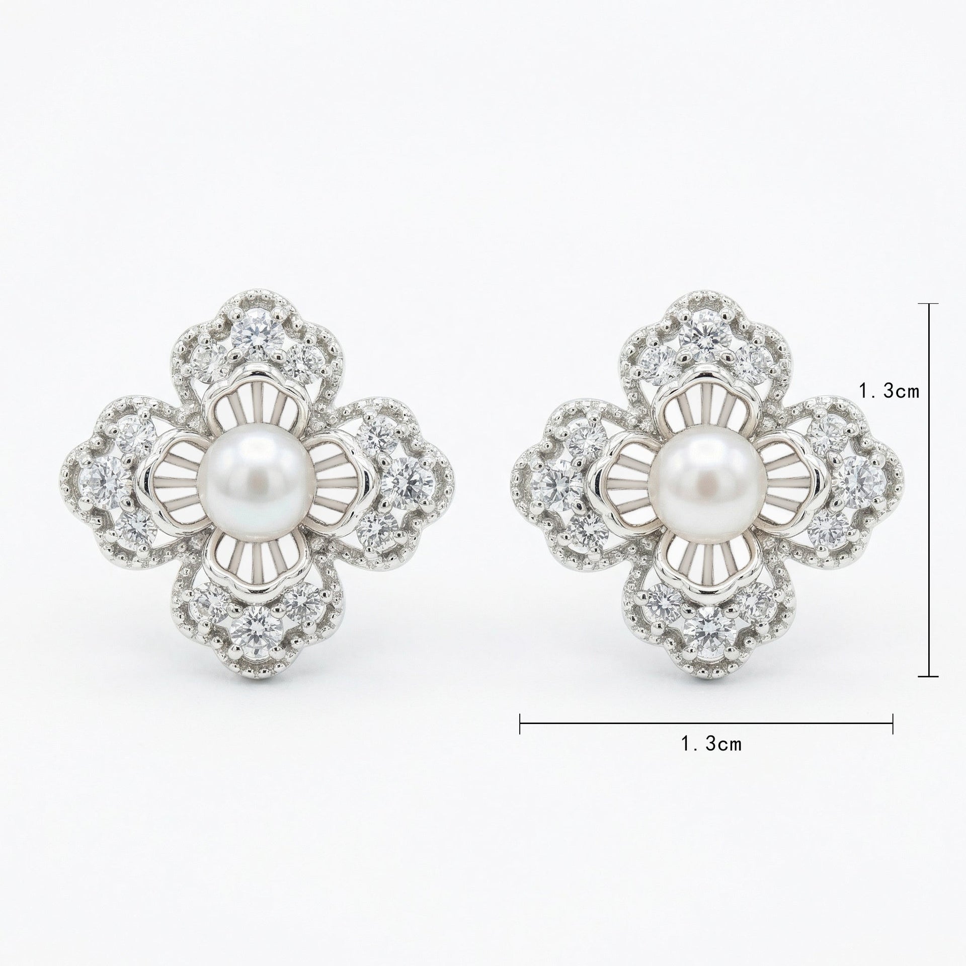 925 Sterling Silver Elegant Floral Pearl and Sparkling Accent Stud Earrings in White Metal