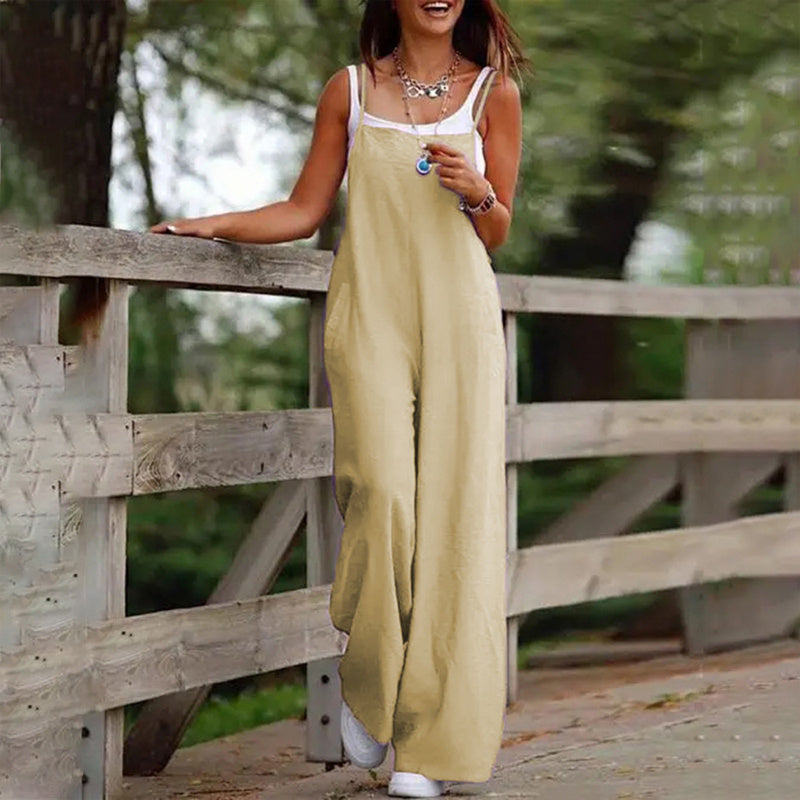 Minimalist linen wide-leg jumpsuit in solid color with side pockets and square neckline