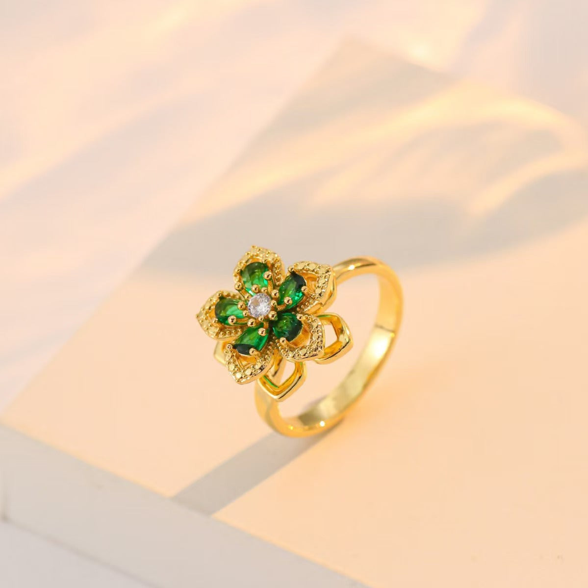 Nephthytis flower rotating ring featuring zircon diamond inlay in vibrant gemstone colors