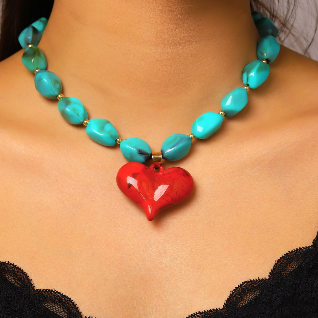 Vintage bohemian resin heart pendant necklace in vibrant red and blue color palette