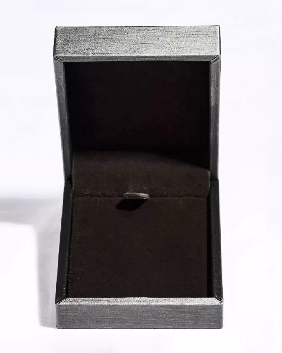 Black ring box with a silver rim on a white background