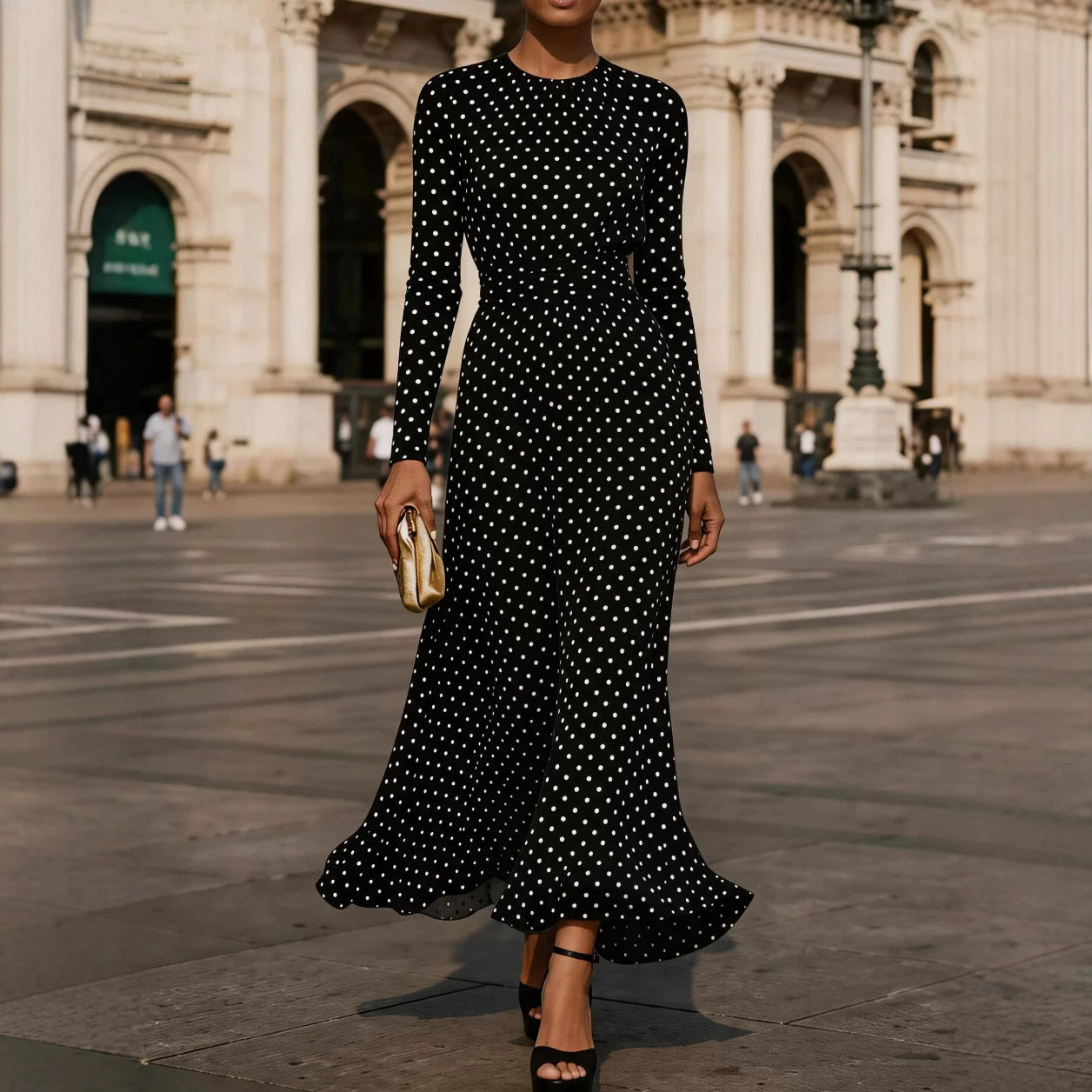 Close up of a black and white polka dot chiffon sheath dress with long sleeves