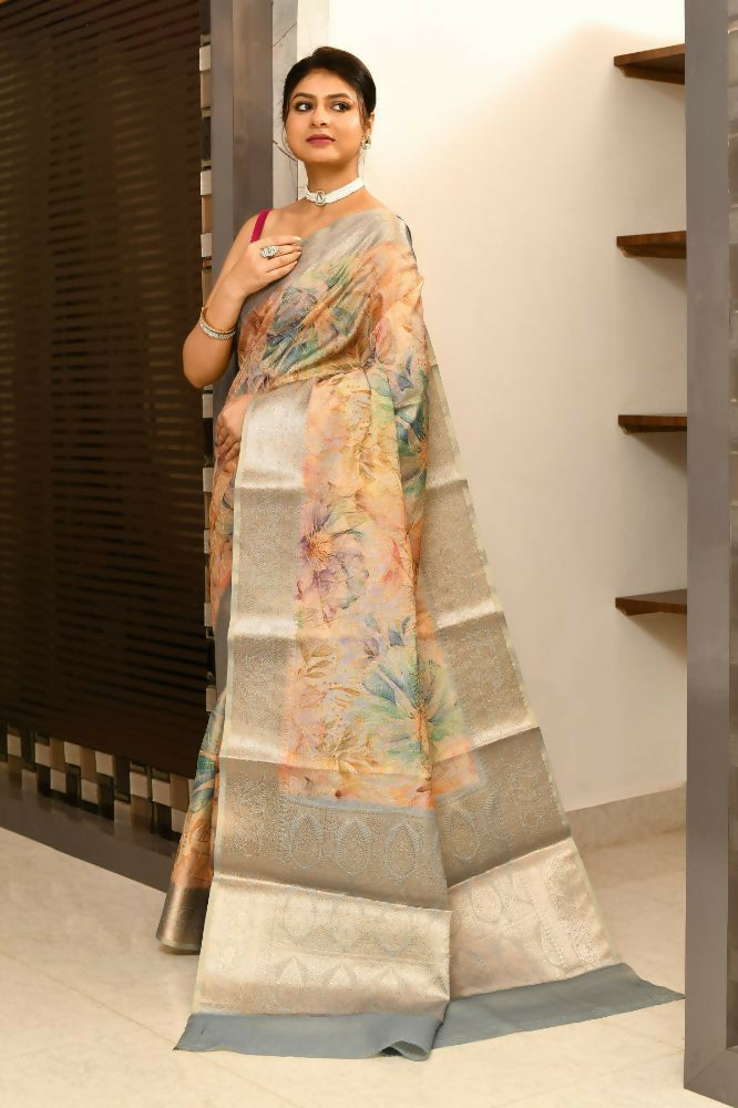 Grey and orange tissue fabric saree with intricate digital prints and elegant embroidery
