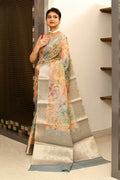 Grey and orange tissue fabric saree with intricate digital prints and elegant embroidery
