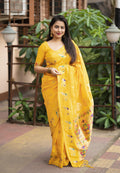 Yellow pure silk saree with intricate woven zari design and pallu tassels