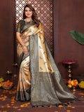 Close-up of a mustard tissue silk saree with intricate woven details and an elegant sheen.