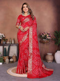 A stunning red pure Dola silk saree with intricate handmade Bandhej pattern for festive occasions.