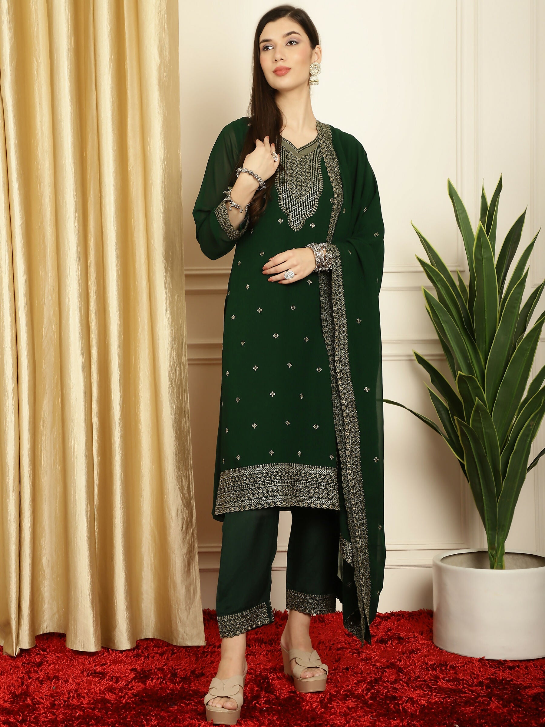 Green georgette kurta with resham thread and sequin detailing paired with santoon trousers