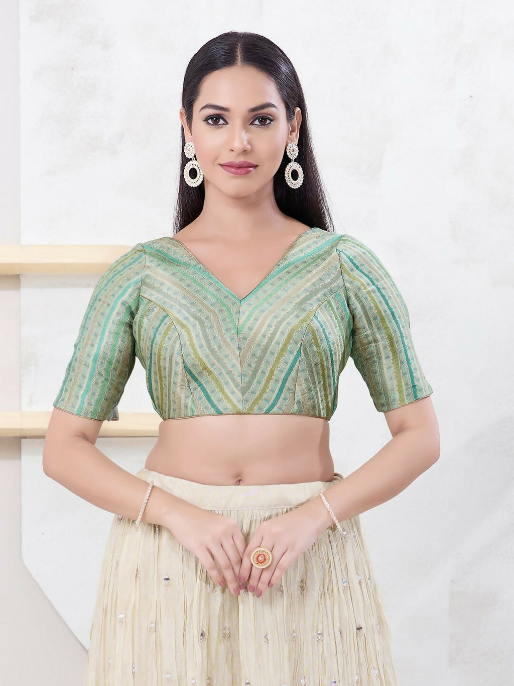 Pista-green jacquard sleeveless blouse with a back-open V-neck design
