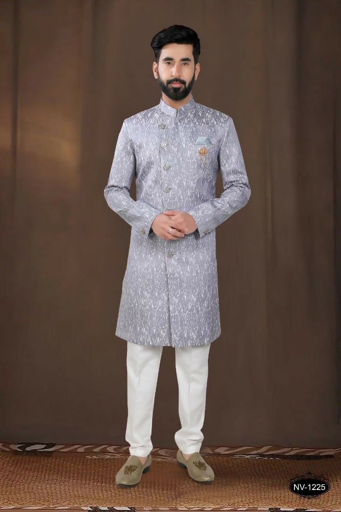 A stylish grey woven jacquard kurta paired with white pyjamas for boys
