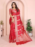 A beautiful red soft organza silk saree featuring intricate weaving patterns and a matching blouse piece.