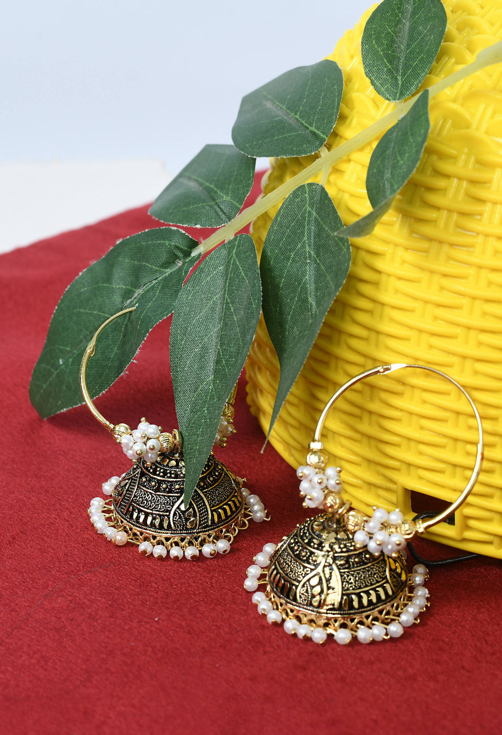 Traditional Golden Jhumka Earrings with Black and White Accents