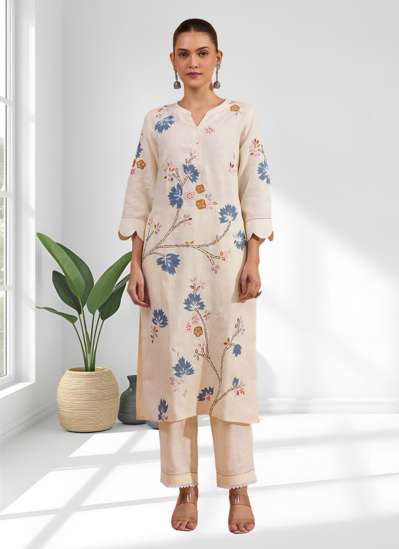 Elegant cream linen long kurta featuring subtle embroidery, paired with matching pants for a casual event.