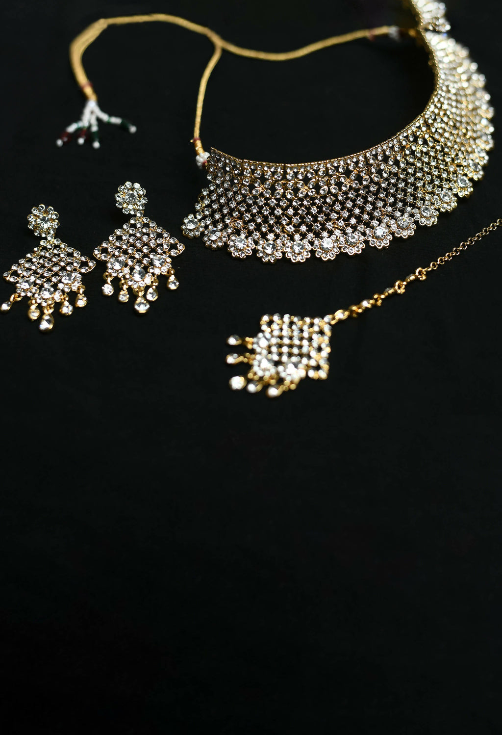 Traditional Rajwadi style heavy golden choker necklace set with white stone accents