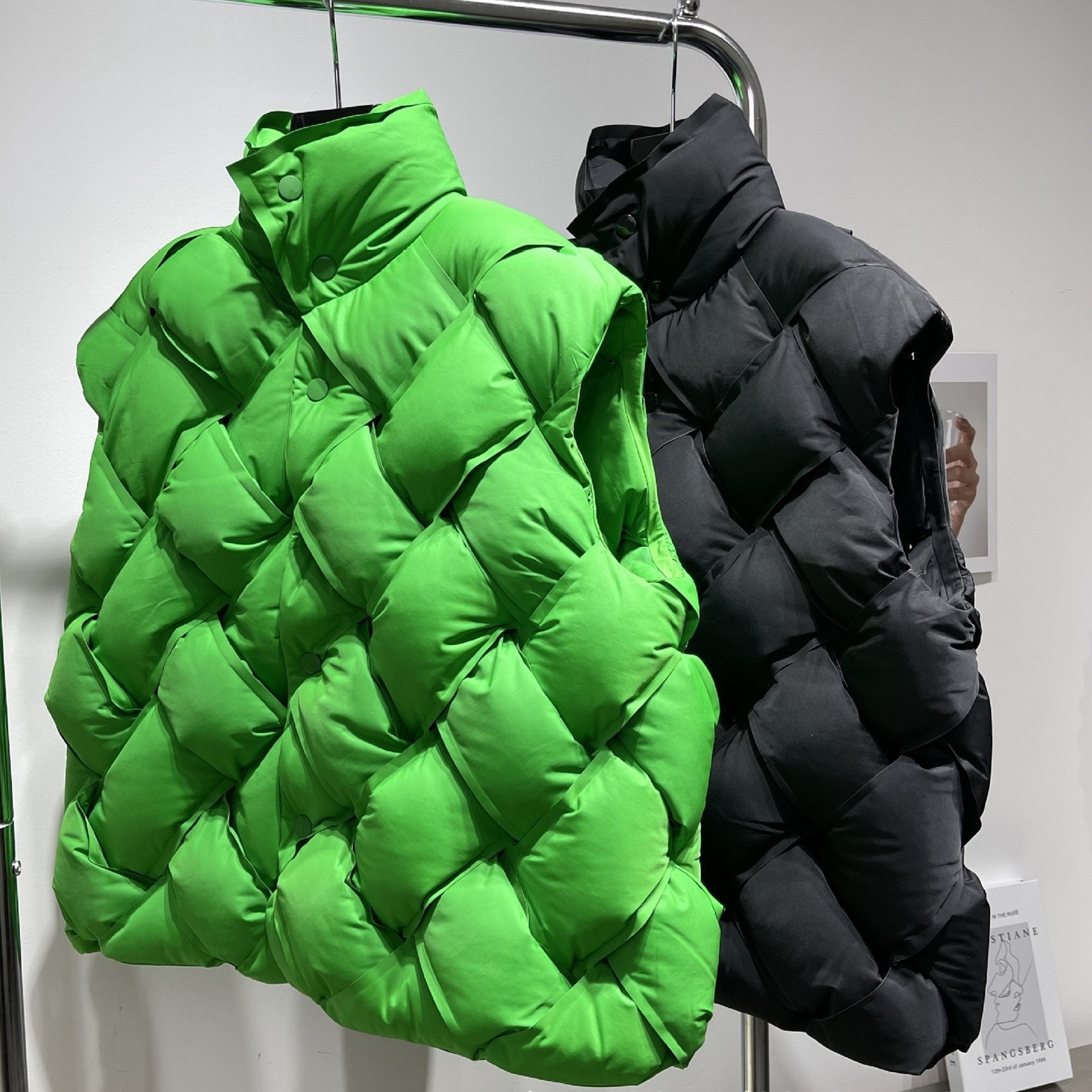 Model wearing a vibrant green woven pattern quilted puffer vest with a black long-sleeve top and beanie, showcasing Harajuku style.