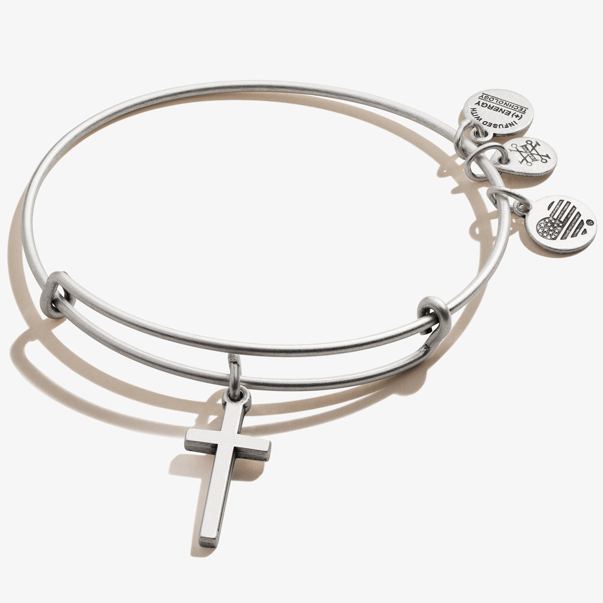 Classic cross charm bangle in a polished finish, perfect for everyday wear.