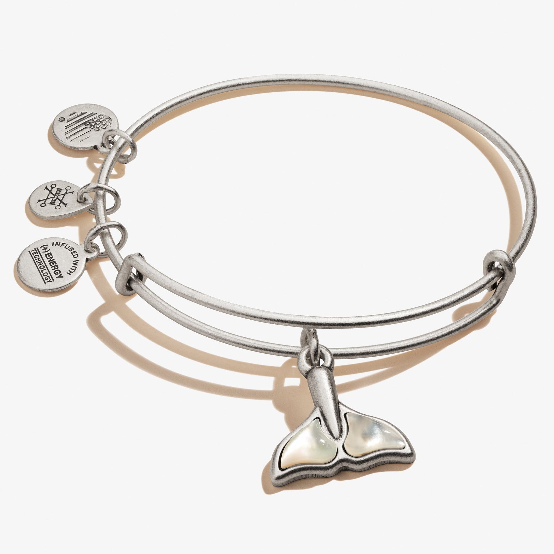 Alex And Ani whale tail charm bangle with a Mother of Pearl stone accent.