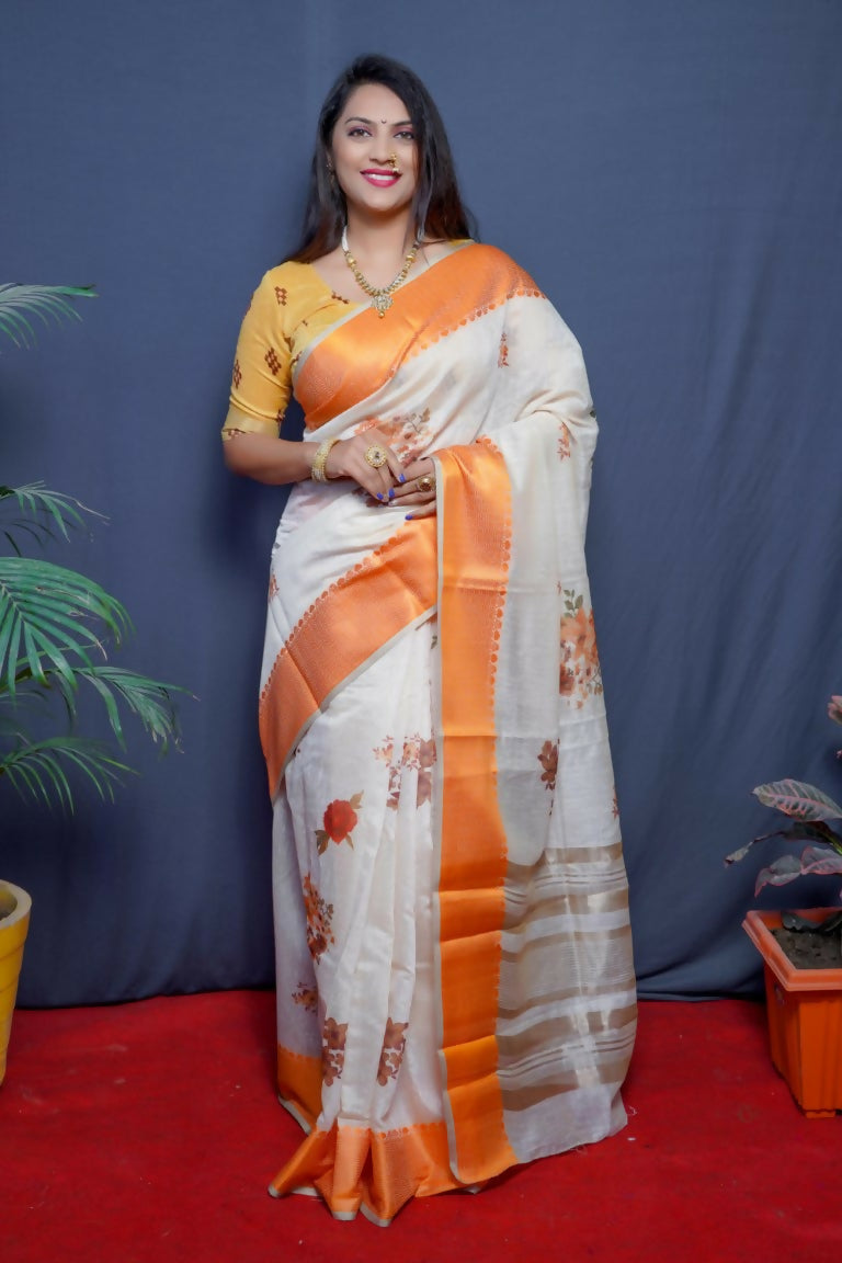 Orange linen silk saree with digital print and jacquard border, paired with a mustard blouse.