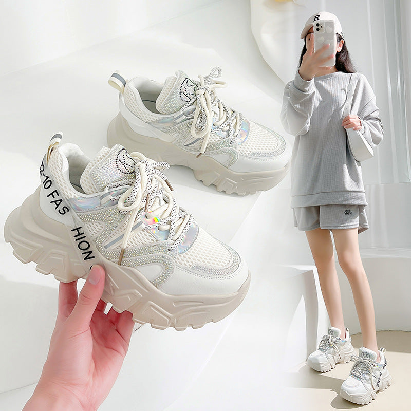 Pair of Harajuku Style women's platform chunky sneakers in white and purple, featuring mesh panels, holographic accents, and a thick sole, with a model wearing them casually.