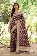 Plum purple soft silk Banarasi handloom saree with a smooth, elegant finish.