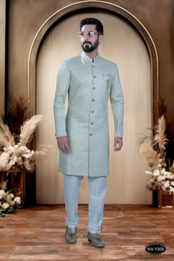 Toddler boy wearing an elegant green silk kurta with thread and sequence embroidery and matching polo pyjamas