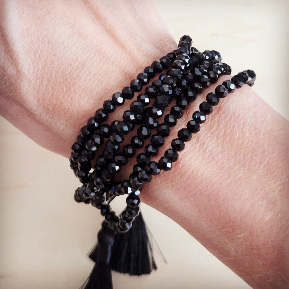 Midnight Multi-Strand Faceted Black Bead Tassel Bracelet - Image 2