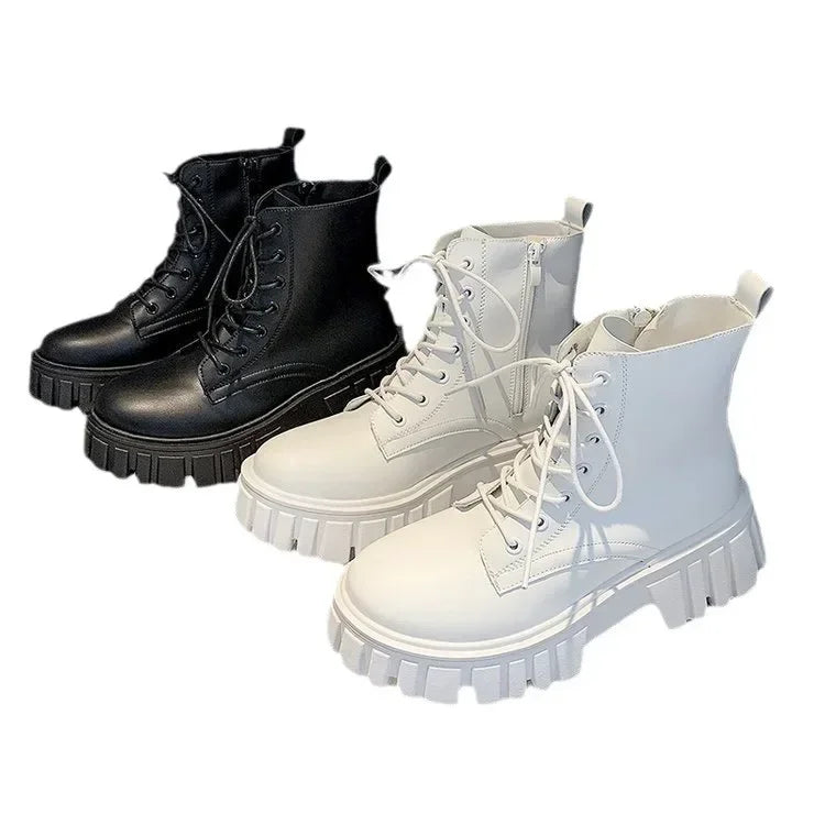 Women's white and black chunky platform ankle boots with lace-up and zipper closure, shown individually and on a model.