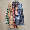 Front view of women's multi-color patchwork plaid loose fit shirt featuring red, blue, yellow, and green patterns, a collared neckline, button-front, and distressed hem.