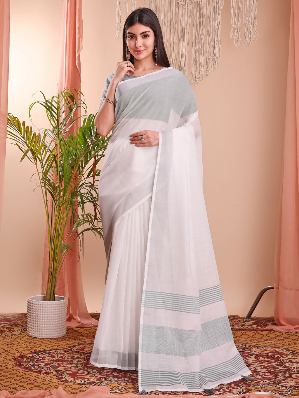 Simple and elegant white linen cotton saree.
