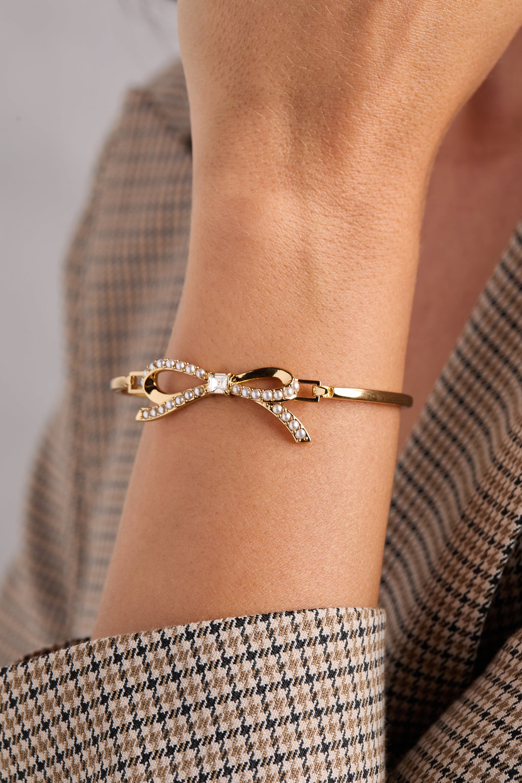 Gold-Plated Bow Pearl Bangle with Crystal Accent