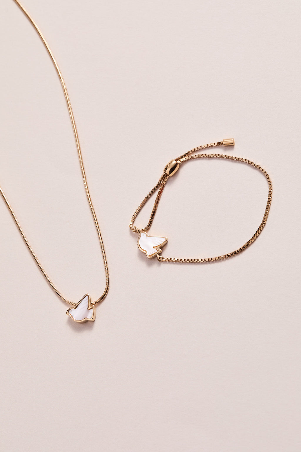 Pearlized Dove Peace Slider Necklace in Gold and White