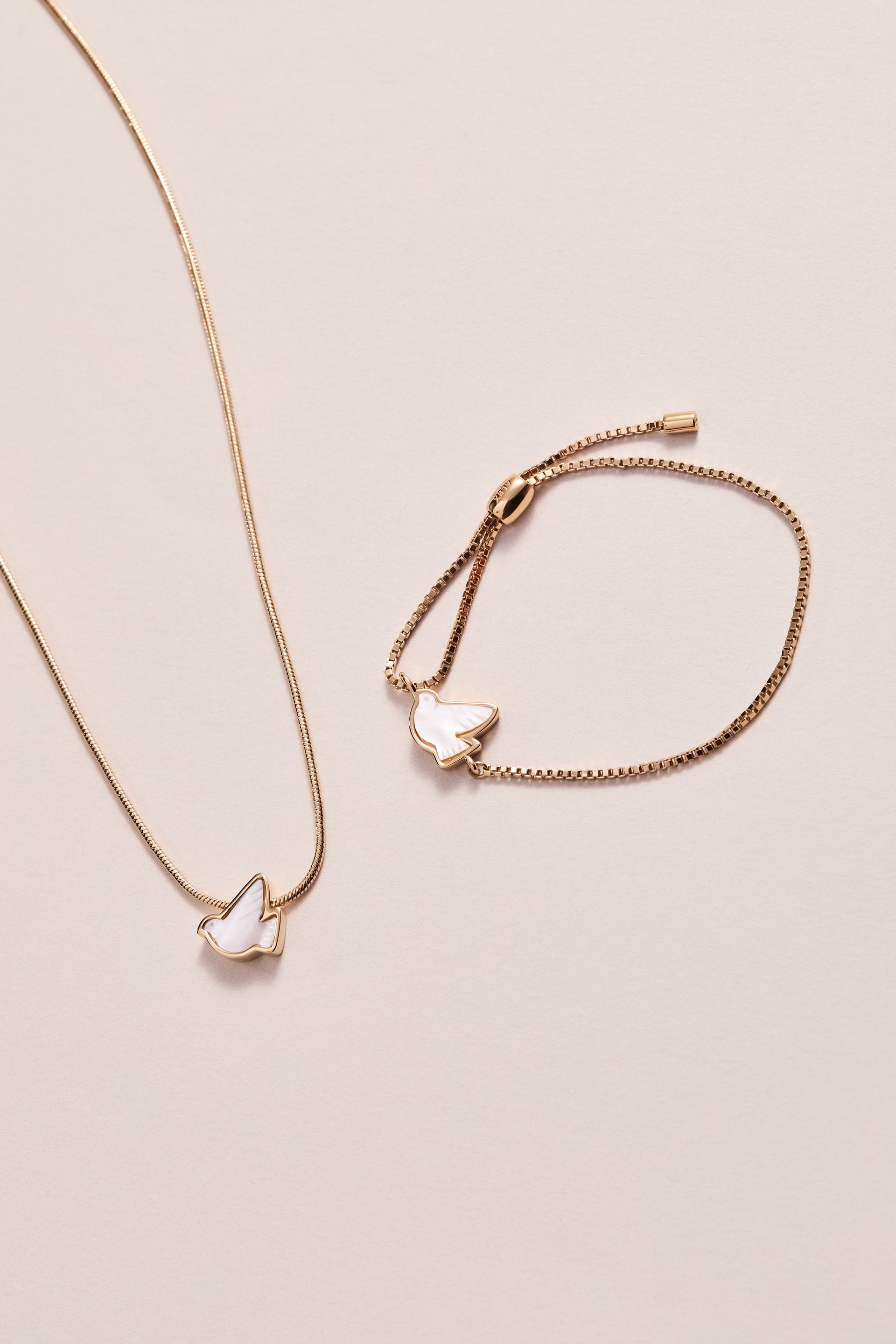 Pearlized Dove Peace Slider Necklace in Gold and White