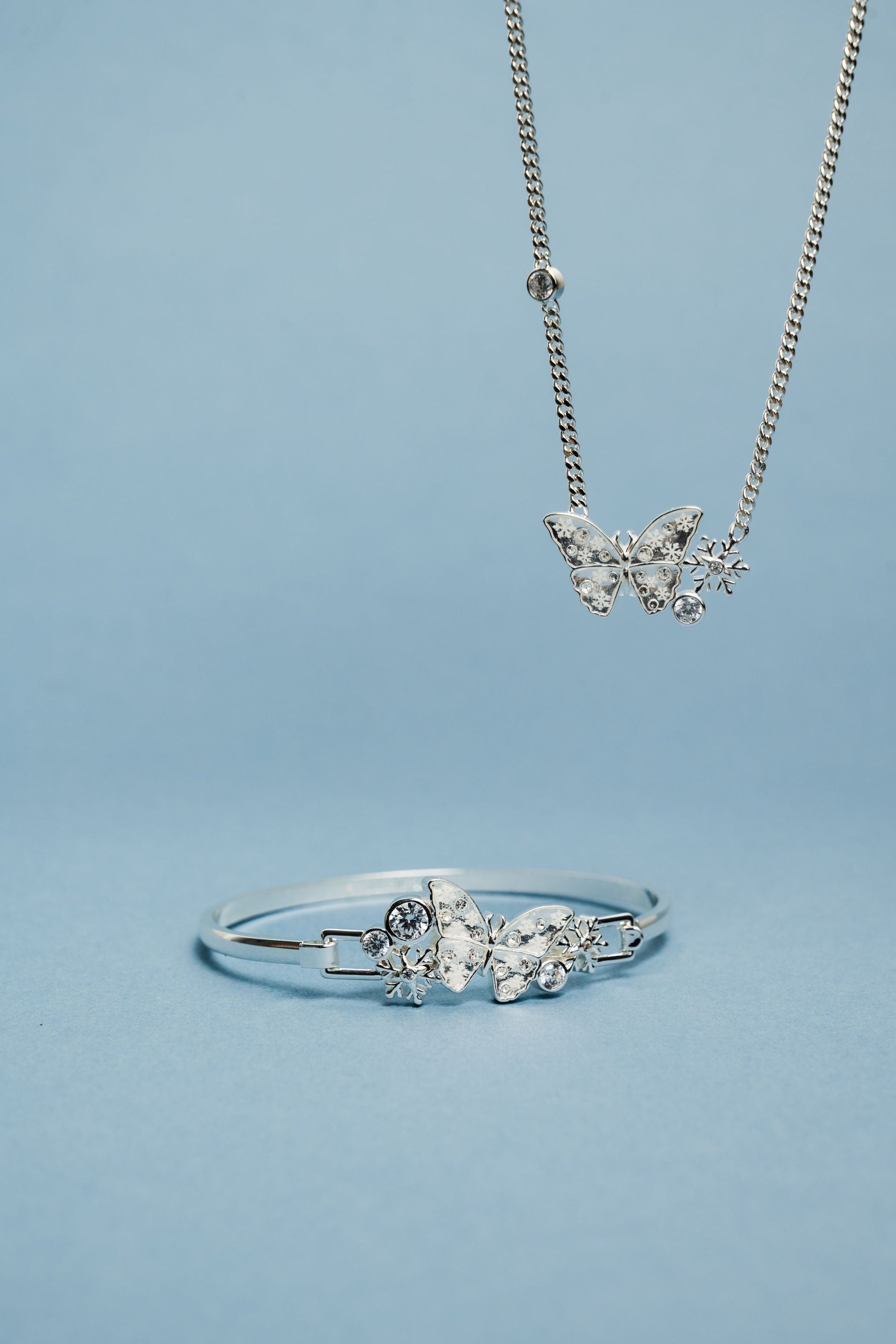 Glass Butterfly Inline Necklace with Snowflake and Crystal Details
