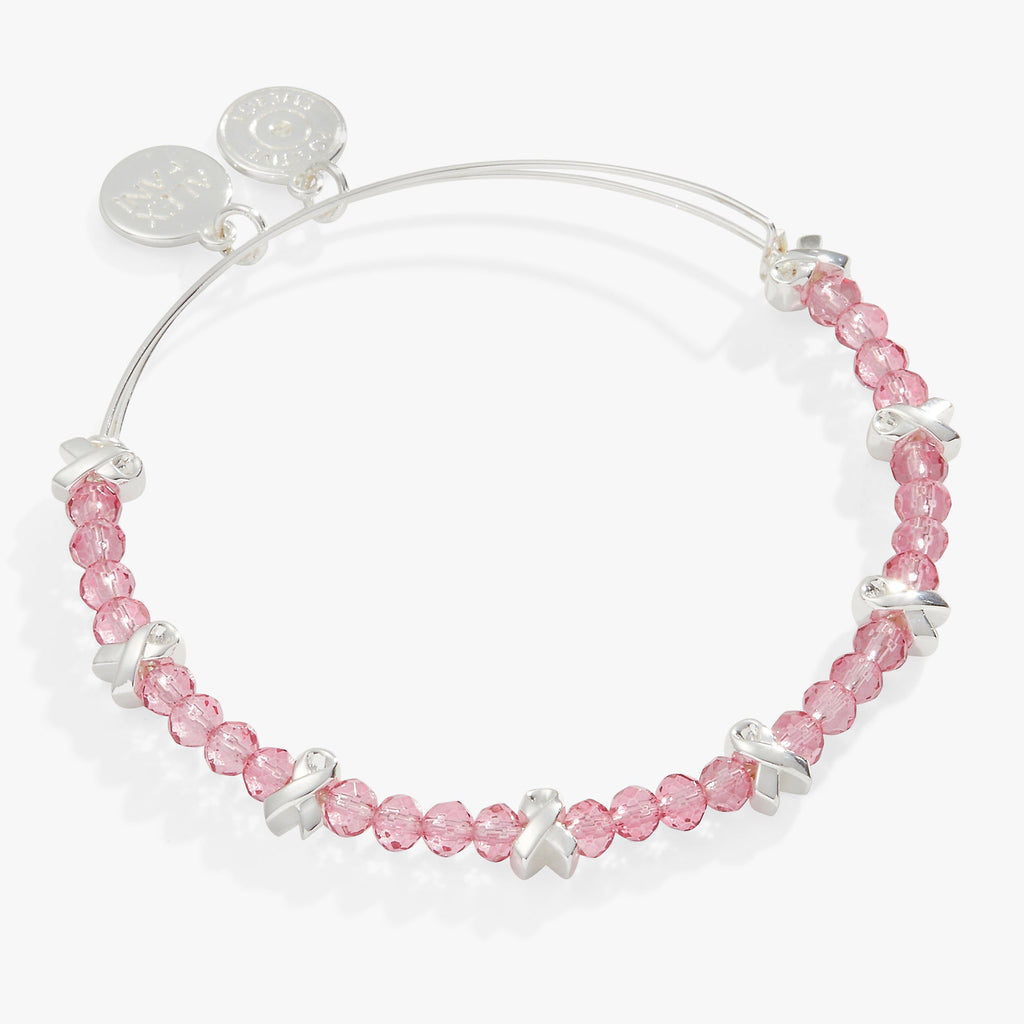 Expandable silver wire bangle with pink faceted glass beads and a breast cancer awareness ribbon charm.