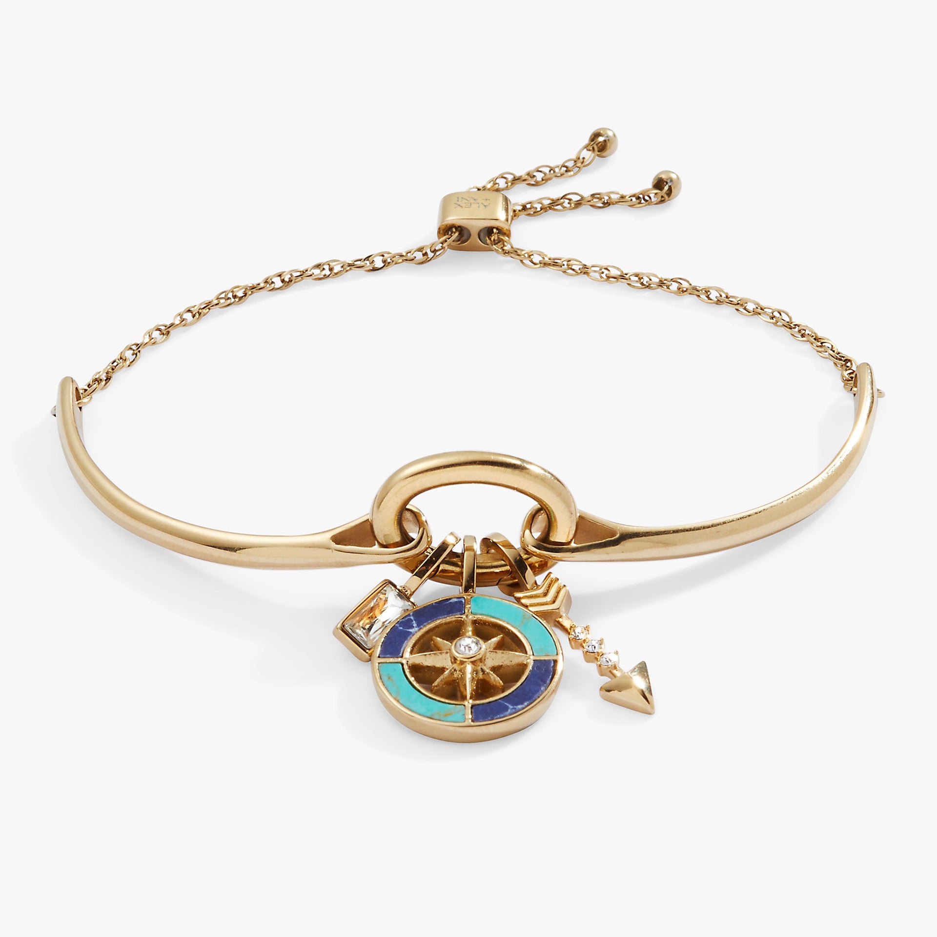 New Beginnings trio charm bracelet featuring a compass and blue gemstone charms.