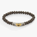 Antique heart charm bracelet with matte brown textured glass beads and black epoxy detail.